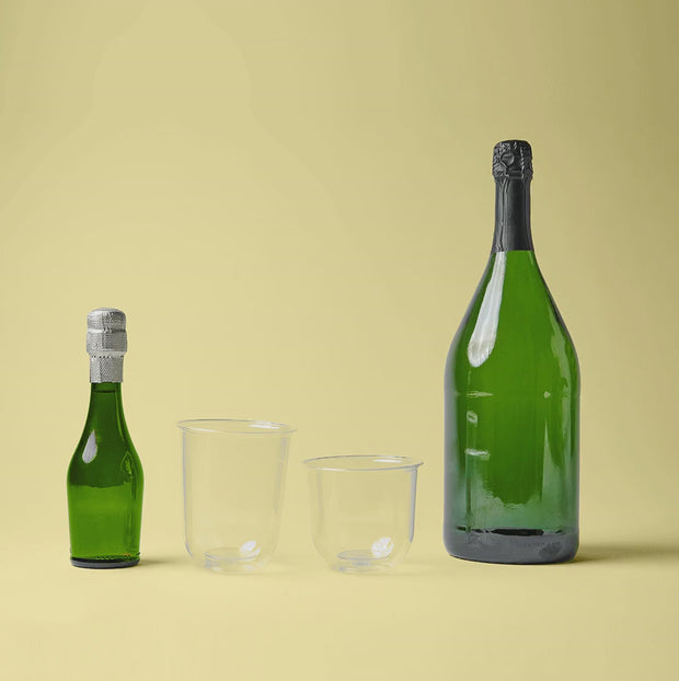 Repurpose Compostable Stemless Wine Cups (12 oz), 50 per pack served with champaign together with the Repurpose Compostable Cocktail Cup, 50 per pack