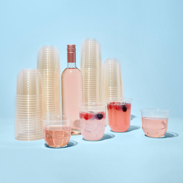 Repurpose 100% Compostable Happy Hour Bundle & Packaging. Includes our Repurpose 12oz Stemless Wine Cups and Repurpose 16oz Cocktail Cups, paired with rosé and berry cocktails.